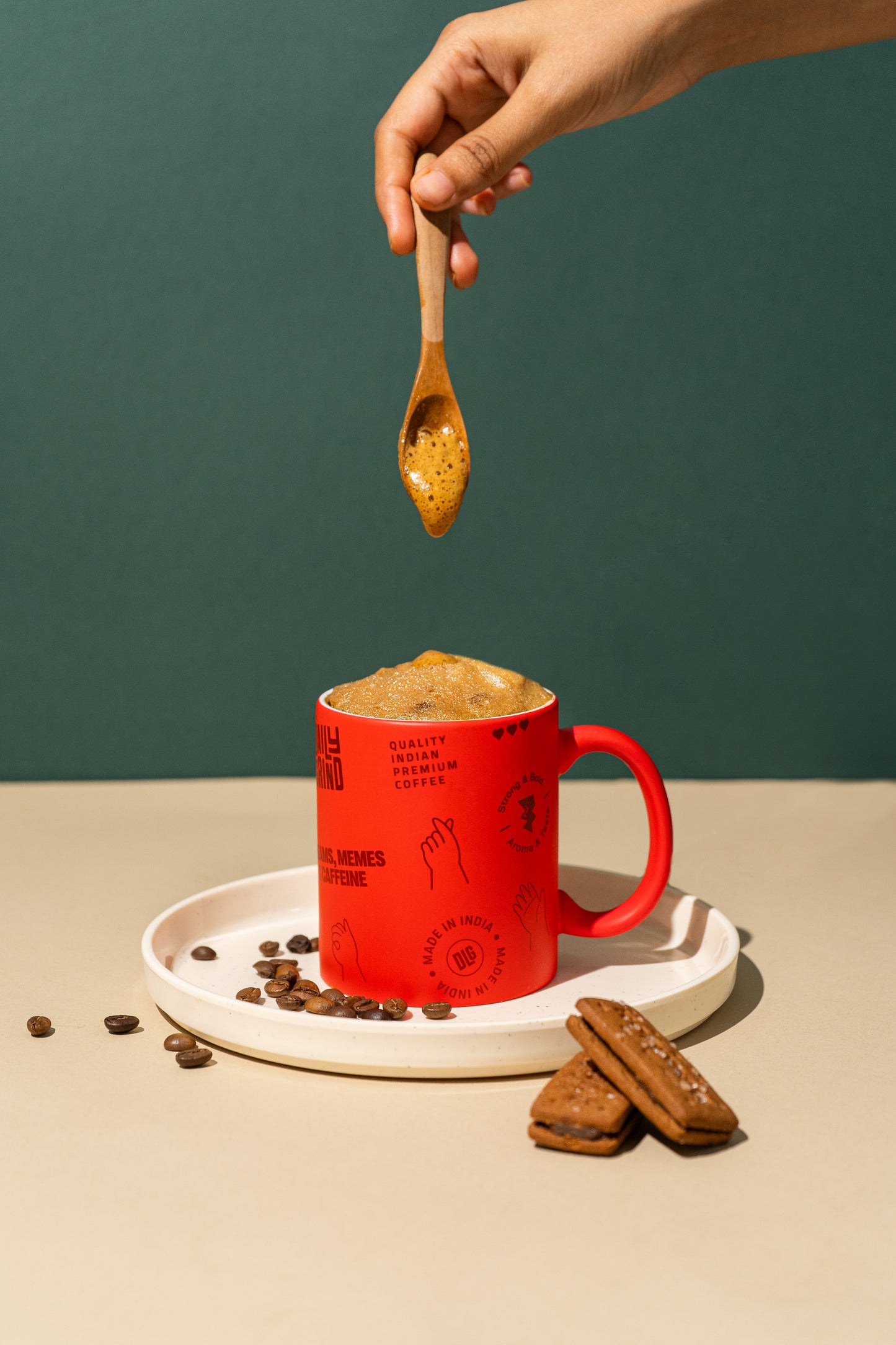 "Frothy coffee in red coffee mug